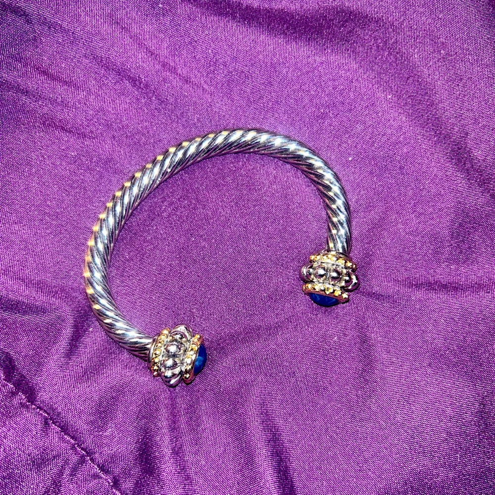 Silver tone bracelet with blue stones